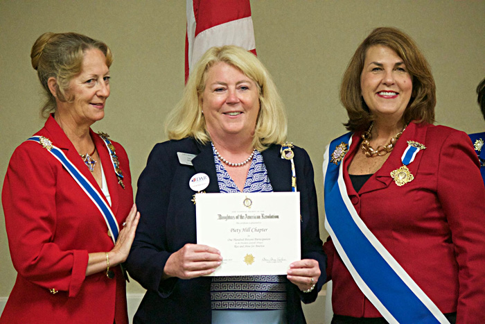 Lisa Milton receiving the Piety Hill 100% President Generals Project Certificate